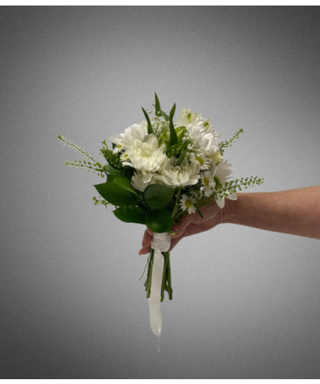 white flowers in small nosegay held in manicured hand